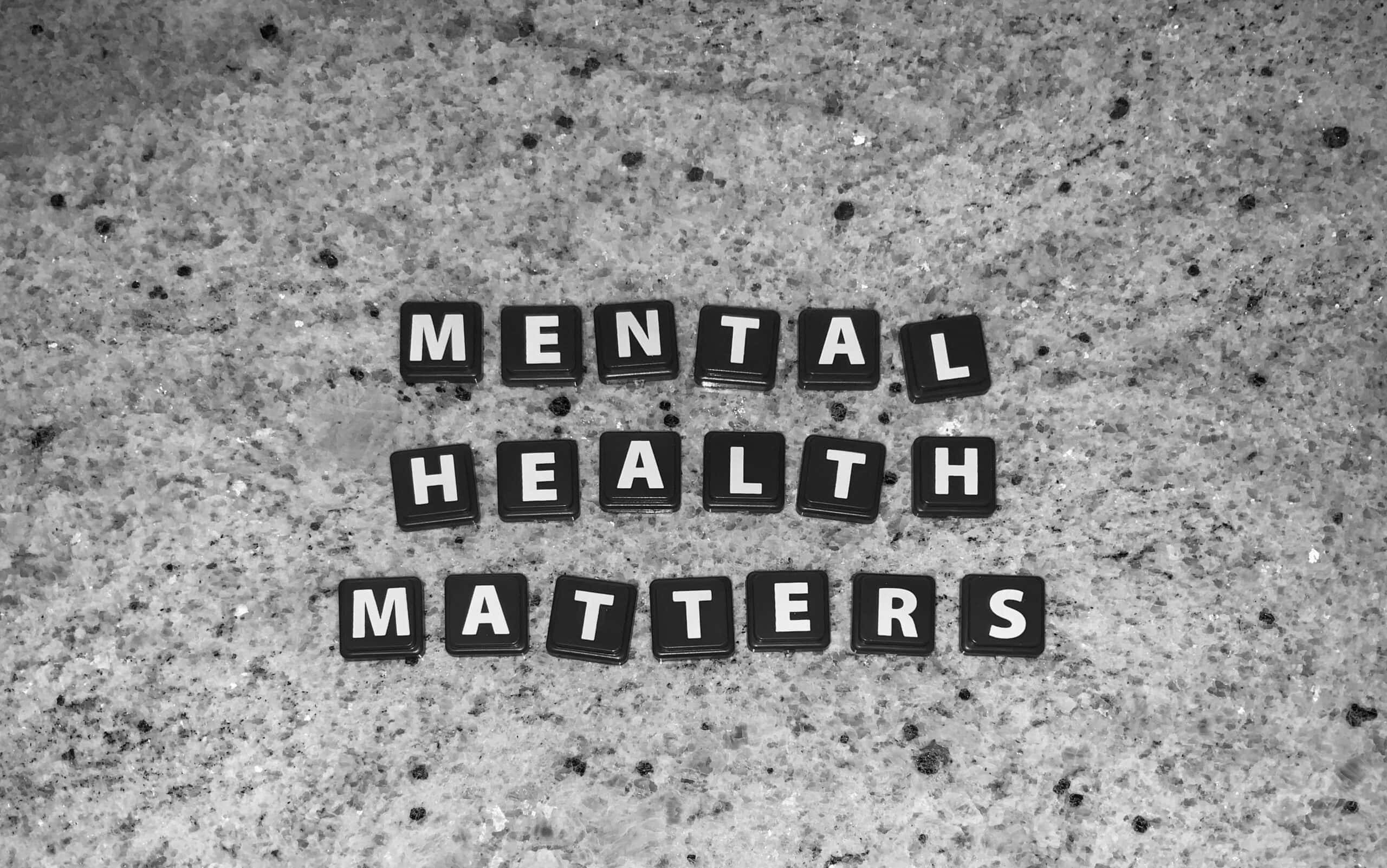 Letters arranged to form "Mental Health Matters" on countertop