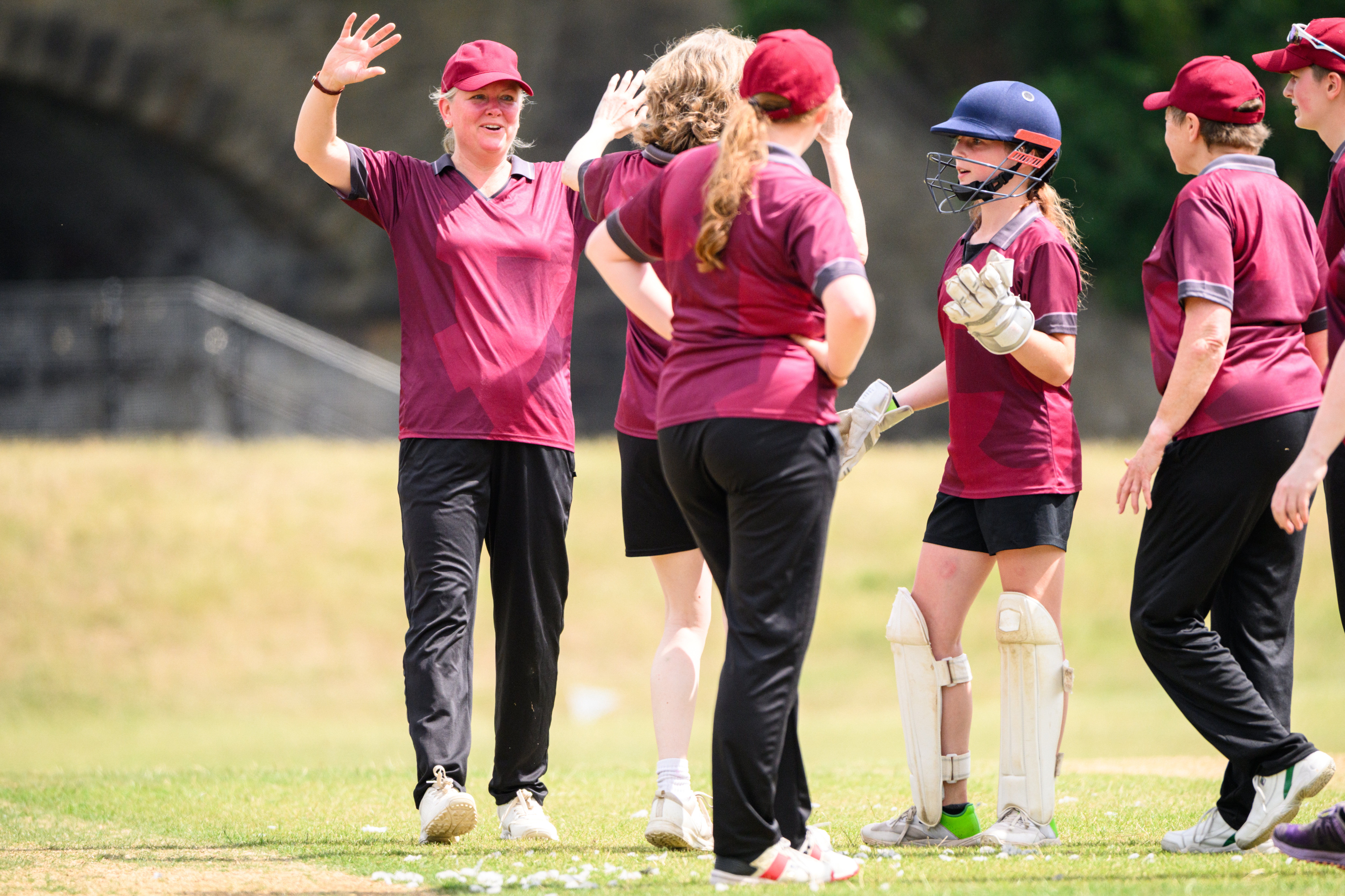 Metro Bank Women and Girls' In Cricket in field with coach and players